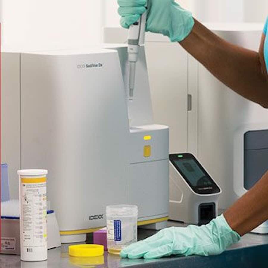 Lab technician using medical analysis equipment