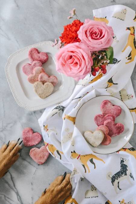 Heart-shaped cookies with roses and dog paws.